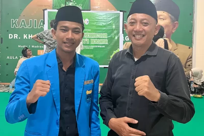 Lalu Rizki Hidayat, Ketua PC PMII Kota Mataram bersama Ipda Andri, Perwakilan Polrestas Mataram
