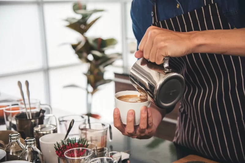 close-up-hands-coffee-barista-man-make-hot-cup-esp-barista-bekasi